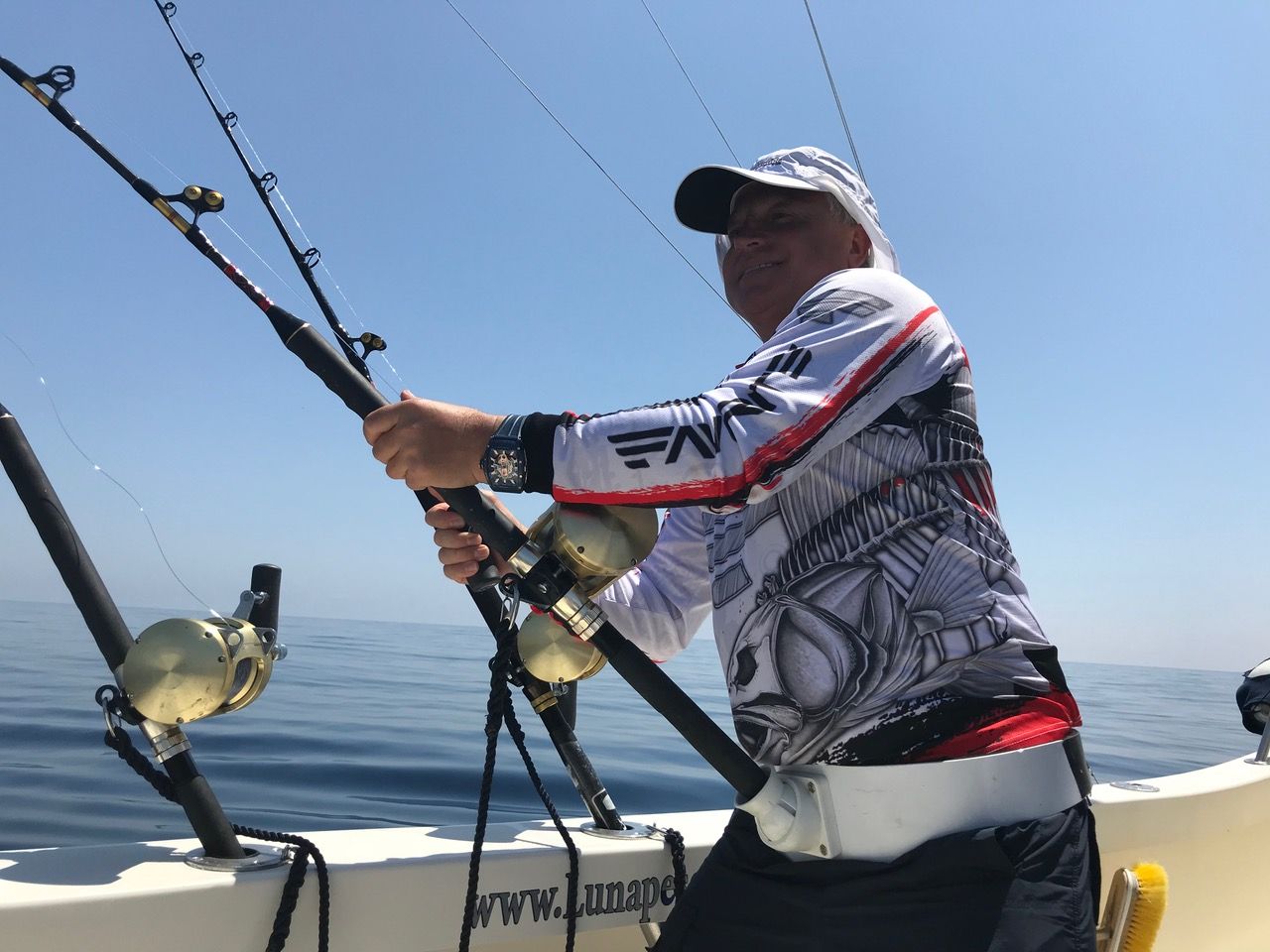 Angler fighting a fish on the Luna, Marbella